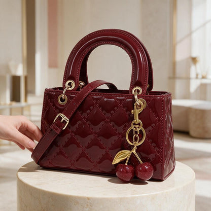 Burgundy Patent Handbag, Quilted Top Handle Purse, Cherry Charm Crossbody Bag, Red Shoulder Bag, Elegant Women’s Handbag
